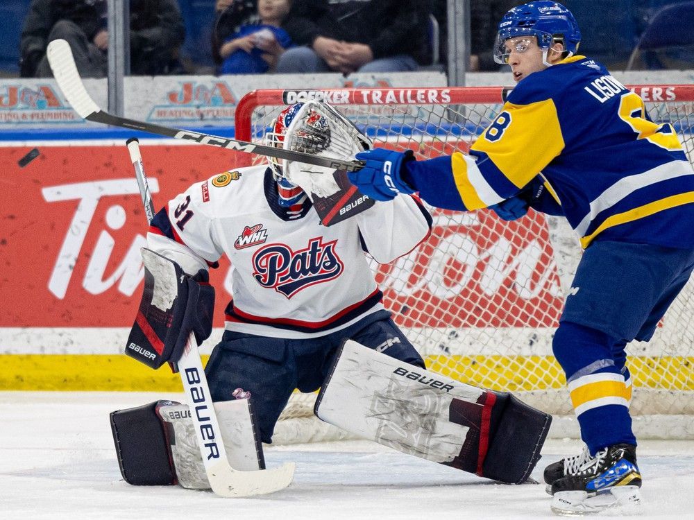 Saskatoon Blades forward Brandon Lisowsky (8) deflects the puck on the Regina Pats during WHL action at SaskTel Centre. Photo taken in Saskatoon, Sask. on Wednesday, January 31, 2024.