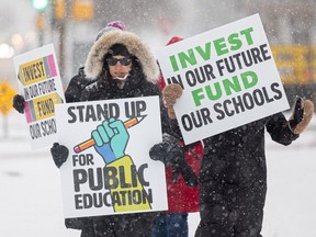 Teachers take part in a one-day strike in Saskatoon on Feb. 7, 2024 as part of an ongoing labour dispute between the province and the Saskatchewan Teachers' Federation.