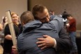 Coroner’s counsel Timothy Hawryluk hugs James Smith Cree Nation Chief Wally Burns after the inquest into the apprehension and death of Myles Sanderson, who killed 11 people and injured 17 others on James Smith Cree Nation and the nearby community of Weldon back in September 2022. Photo taken in Saskatoon, Sask. on Thursday, February 29, 2024. (Michelle Berg / Saskatoon StarPhoenix)