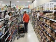 People shop inside a grocery store in Toronto in July of 2023.