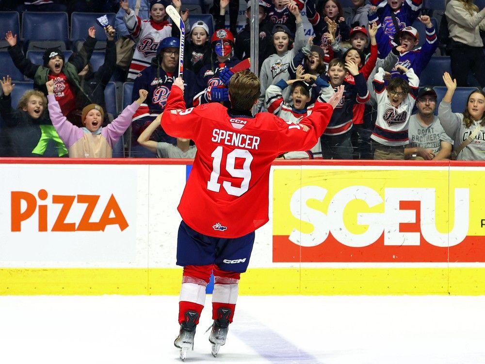 Tye Spencer celebrates with Regina Pats fans after being named first star in a 7-6 WHL shootout victory over the visiting Red Deer Rebels on Feb. 4/24. KEITH HERSHMILLER PHOTOGRAPHY / Regina Pats