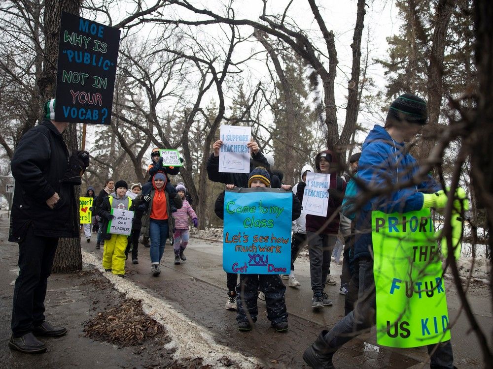 Students and supporters of the Saskatchewan Teachers Federation march down Albert street near the Saskatchewan Legislative Building on Friday, February 2, 2024 in Regina.