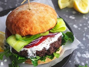 This October 2021 photo shows a burger from a Vancouver restaurant that combines beef and vegetable protein, allowing diners to reduce their meat consumption.