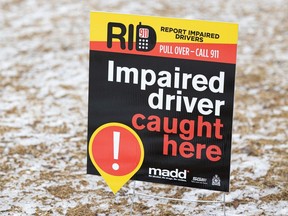 An "impaired driver caught here" sign fis placed on the front lawn of a home in Saskatoon, Sask. on April 1, 2022.