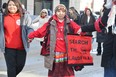 Elder Geraldine Shingoose was one of hundreds who took part in a round dance during a search the landfill rally and round dance held in downtown Winnipeg at the corner of Portage and Main on Friday morning.
