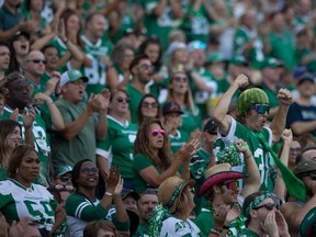 Saskatchewan Roughriders fans celebrate during the second half of the Labour Day Classic game pitting the Saskatchewan Roughriders against the Winnipeg Blue Bombers at Mosaic Stadium on Sunday, September 4, 2022 in Regina.