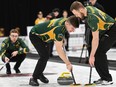 University of Regina skip Josh Bryden watches his sweepers