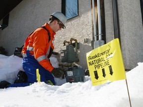 A SaskEnergy employee changes a natural gas meter in Regina, Sask., in February of 2013.