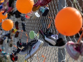 As part of National Day for Truth and Reconciliation in 2022, the Eagle Heart Centre organized a walk in memory of children buried at residential schools. Shoes were put on gates of the centre to remind people of the current generation of children that will be walking on their life journeys.