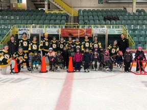 The Humboldt Broncos pose with kindergarten students from St. Dominic School in Humboldt. The kids took part in the Northern Lights Movement for Kids, which was started by Celeste Leray-Leicht.