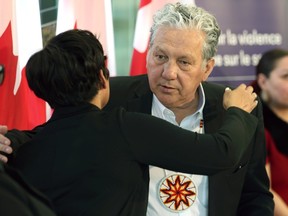 Dan Vandal (St. Boniface-St. Vital MP) embraces federal minister for women Marci Ien during an event to announce funding to prevent and address gender-based violence, at Agowiidiwinan Centre at The Forks in Winnipeg, on Monday, March 25, 2024.