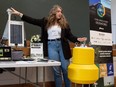 Research technician Katy Nugent with the University of Saskatchewan-based Global Water Futures program shows a floating buoy used to carry instrumentation as part of monitoring and studying the health of bodies of water.