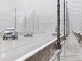 Commuters travel through the snowy, windy morning in Saskatoon on April 17, 2024.