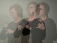 This triple exposure file photo shows ASL interpreter Karen Nurkowski from Saskatchewan Deaf and Hard of Hearing, translating during a COVID-19 news conference in Regina on March 4, 2020.