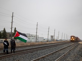 Pro-Palestine protestors on a CP Rail line in Regina