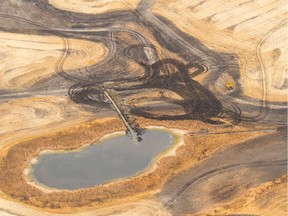 A trench cuts into a wetland in order to drain it, and prepare it for cultivation in the Quill Lakes area of Saskatchewan in this October 2017 aerial photo. The dark areas used to be wetlands. MICHAEL BELL / Regina Leader-Post.