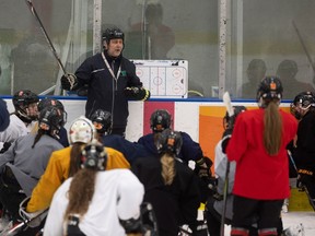 Rebels head coach Kim Perepeluk talking to his team during a recent practice.