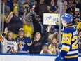 Fans salute Saskatoon Blades forward Easton Armstrong (27) after losing to Moose Jaw Warriors in overtime in game 7 at SaskTel Centre in Saskatoon, May 7, 2024.