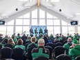 Saskatchewan Roughriders head coach Corey Mace answers fans' questions following the State of Rider Nation address with, from left, CEO Craig Reynolds and general manager Jeremy O'Day during Green and White Day at SMF Field in Saskatoon on May 18, 2024.