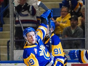Saskatoon Blades forward Egor Sidorov (19) celebrates with teammates after scoring against Moose Jaw Warriors during the second period of the first game of WHL Eastern Conference final at SaskTel Centre in Saskatoon, Sask., on Friday, April 26, 2024.