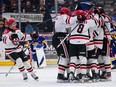 Moose Jaw Warriors celebrate after defeating Saskatoon Blades during overtime in Game 1 of WHL Eastern Conference final at SaskTel Centre in Saskatoon, Sask., on Friday, April 26, 2024. The Warriors have since taken a 2-1 lead in the best-of-seven series.