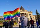 Jared Clarke, MLA for Regina Walsh Acres, holds a pride flag during the 2SLGBTQ+ rally outside the Saskatchewan Legislative Building in Regina on Friday, May 17, 2024.