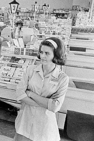 Safeway supermarket checker Ann Paris stands at one of the five food chains being boycotted by some 100,000 Denver housewives who are protesting the high price of groceries. October 17, 1966 Denver, Colorado, USA