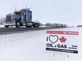 An "I love Canadian oil and gas" sign sits in the snow near Moosomin, Sask., in February of 2019.