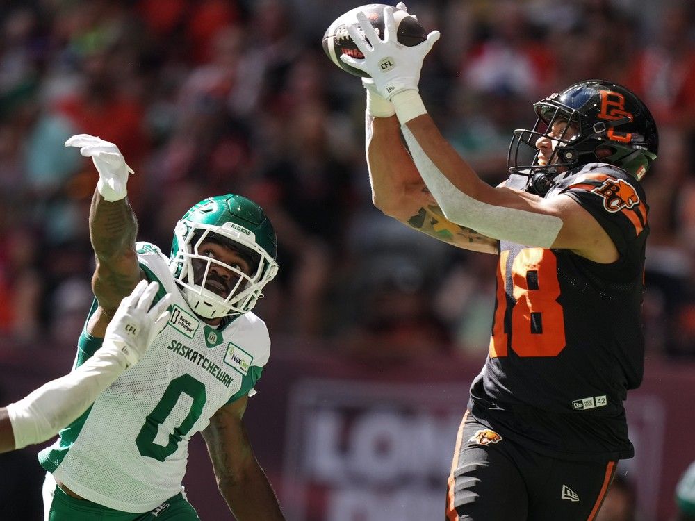 B.C. Lions' Justin McInnis makes a touchdown reception as Saskatchewan Roughriders' Rolan Milligan Jr. defends during CFL game in Vancouver July 13, 2024.