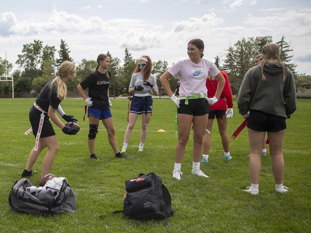 Players from the Saskatchewan-based girls 15U flag football team practice at Ecole Wilfrid Walker School on Wednesday, July 3, 2024 in Regina. The team is practicing in Regina before departing to California to play at the world championships.