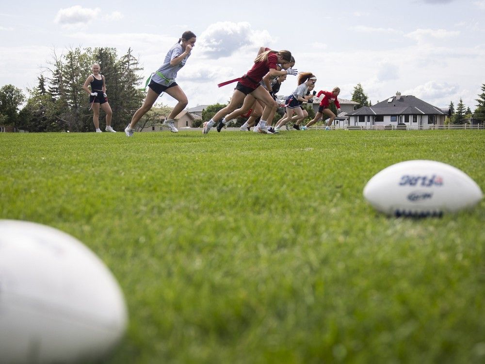 Players from the Saskatchewan-based girls 15U flag football team practice at Ecole Wilfrid Walker School on Wednesday, July 3, 2024 in Regina.