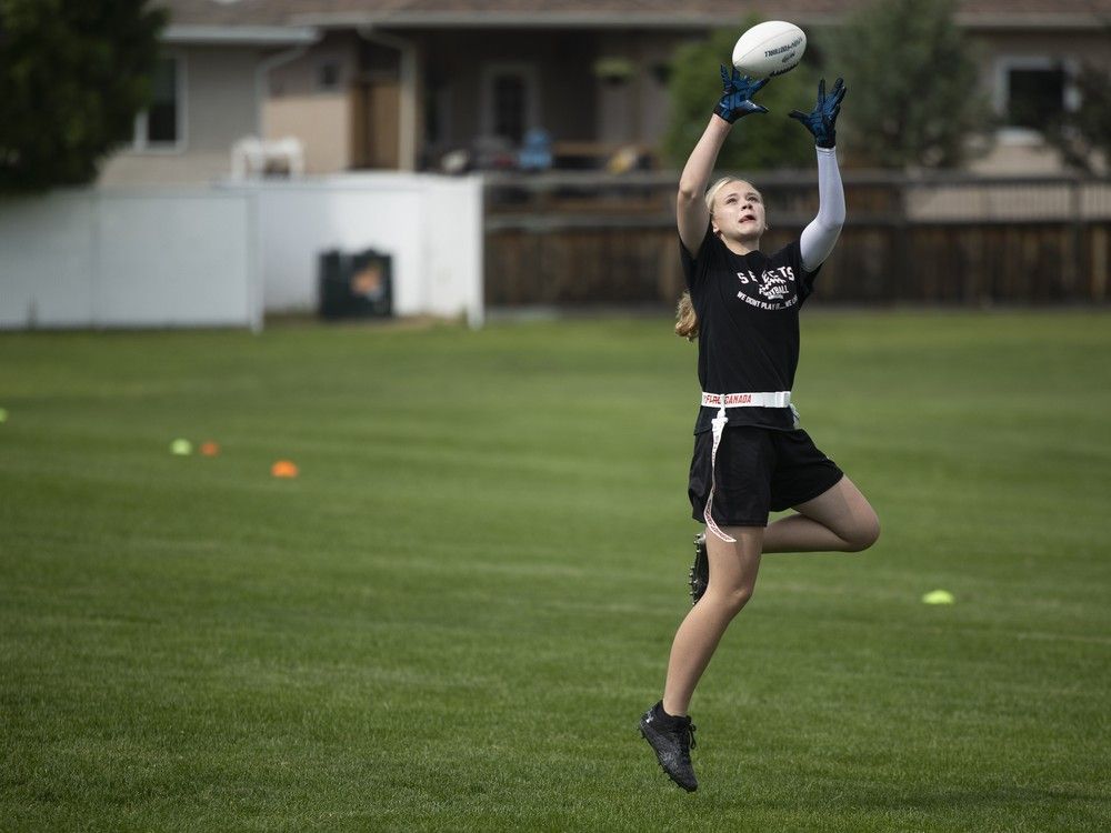 Ellie Wicks from the Saskatchewan-based girls 15U flag football team practices at Ecole Wilfrid Walker School on Wednesday, July 3, 2024 in Regina.