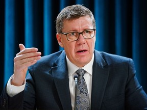 Saskatchewan Premier Scott Moe gestures while speaking during a press conference before Speech from the Throne in Regina, Monday, Nov. 25, 2024.