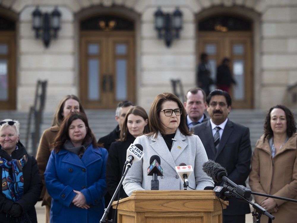  saskatchewan ndp leader carla beck speaks during a media scrum outside the saskatchewan legislative building with her ndp colleagues in the foreground to respond to the us tariff threats on tuesday, march 4, 2025 in regina.