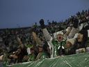 Saskatchewan Roughriders fans celebrate after a touchdown during first half CFL playoff action inside Mosaic Stadium on Saturday, November 2, 2024 in Regina.