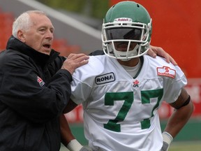 Saskatchewan Roughriders linebackers coach Alex Smith with Dwayne Eley during day two of the Saskatchewan Roughriders Rookie Camp at Mosaic Stadium in Regina on June 3, 2010.