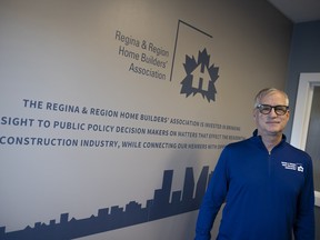 Stu Niebergall stands in front of the RRHA sign in the office