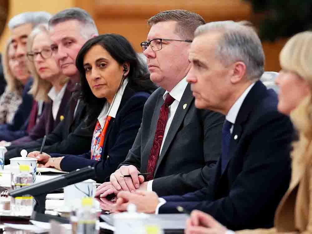 Premier of Saskatchewan Scott Moe, third from right, sits beside Canadian Prime Minister Mark Carney, second from right, as they take part in a bilateral meeting with Premier of China Li Qiang at the Great Hall of the People in Beijing on Thursday, Jan. 15, 2026.