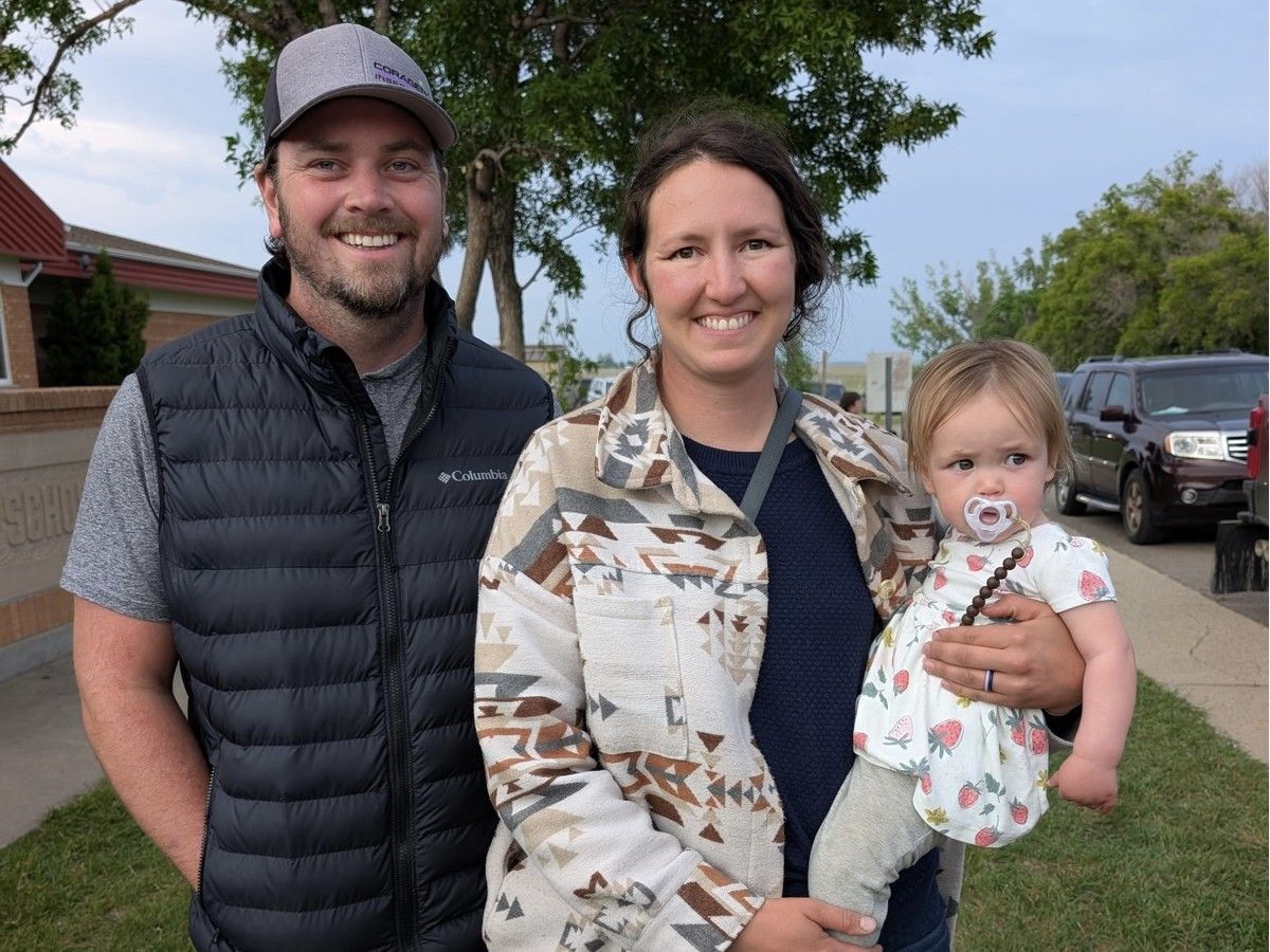  Kirsten Oram, left, with husband Dane Oram and daughter Lachlyn have a grain and cattle farm near Tugaske, Sask.