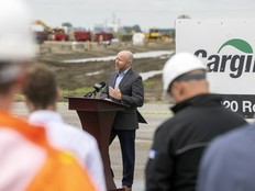 Jeff Vassart speaks at a podium at the ground breaking ceremony outside