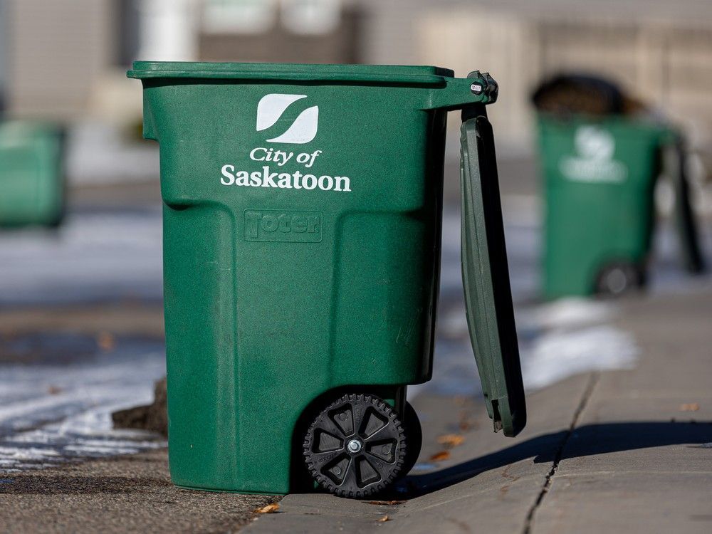 Green carts are placed on the curb in front of houses in Stonebridge for food and yard waste pickup. Photo taken in Saskatoon, Sask. in October of 2023.