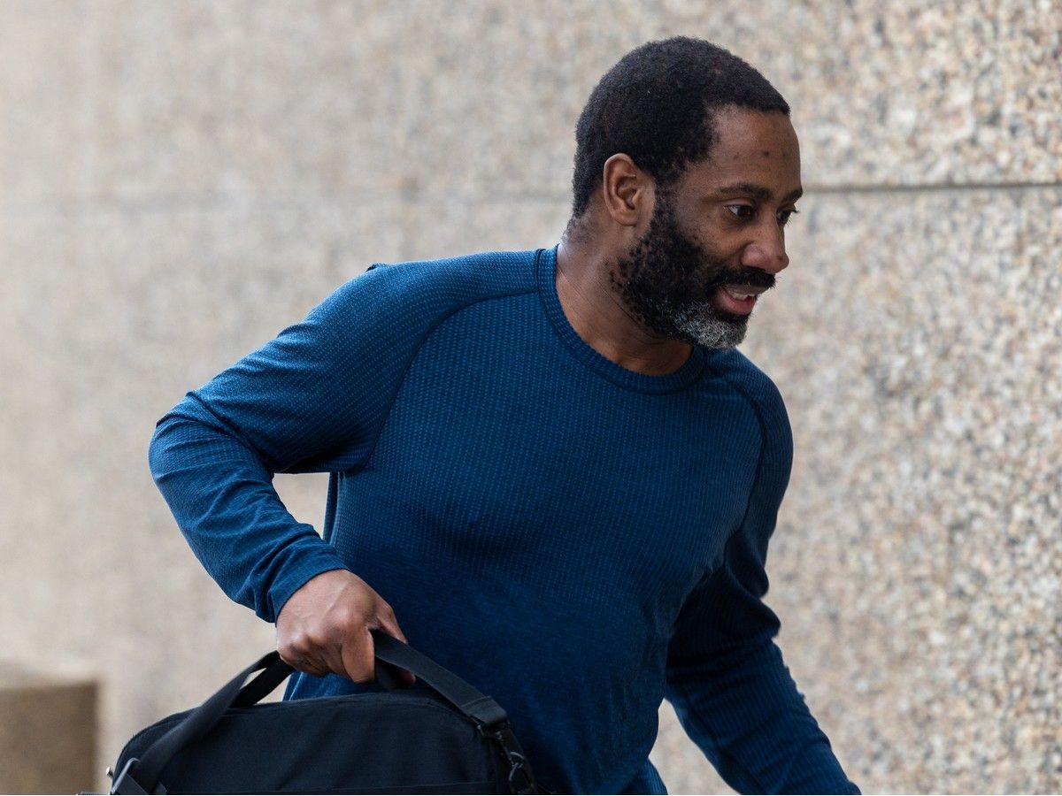 REGINA -- MAY 20/2026 - Aggrey Fynn, who has been charged with fraud and money laundering, runs outside of provincial court in Regina, on Wednesday, May 20, 2026.