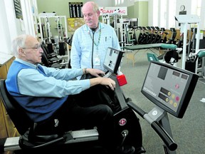 Cardiologist Larry Patrick, right, talks with patient Bill Brady at the Cardiac Fitness Institute at the London Health Sciences Centre earlier this year. (Postmedia file photo)