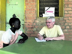 Sister Joan Atkinson interviews Margaret Arek Ajou, 14, for a scholarship. Margaret had to drop out of school when her father lost his job. The Sisters of St. Joseph provide scholarship money for girls and Margaret was accepted . (Glen Pearson photograph)