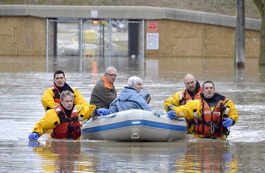 Members of the Chatham-Kent Fire Services dive team arrived on scene at the Siskind and Pegley Court area of Chatham, Ont. on Saturday February 24, 2018 to assist some residents whose homes were flooded. (Louis Pin/Postmedia News)