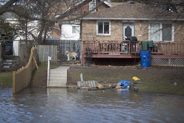 A home at 33 Thomas St. as the street remains completely flooded from the Thames River in Chatham, Sunday, February 25, 2018.  (Dax Melmer, Postmedia News)