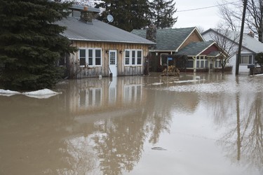 Imperial Road in Port Bruce is flooded from rain and melting snow  on Tuesday February 20, 2018. Derek Ruttan/The London Free Press/Postmedia Network