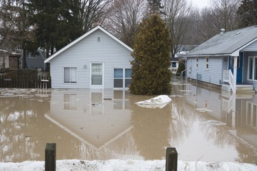 Colin Street in Port Bruce is flooded from rain and melting snow  on Tuesday February 20, 2018. Derek Ruttan/The London Free Press/Postmedia Network