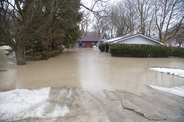 A home on Dexter Line in Port Bruce is flooded from rain and melting snow  on Tuesday February 20, 2018. Derek Ruttan/The London Free Press/Postmedia Network