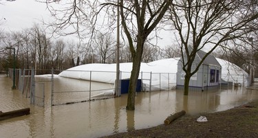 One of the two tennis domes located at Western University deflates on Wednesday February 21, 2018. A heavy flood forced the electrical fans to be shut off, but backup systems were helping until a door opened and the water started to collapse the domes. Mike Hensen/The London Free Press/Postmedia Network